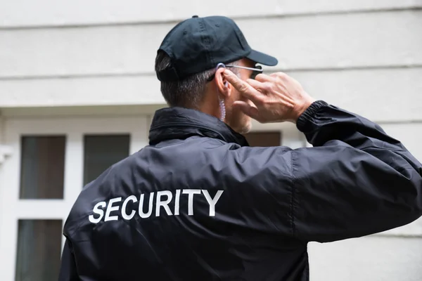 depositphotos_97124196-stock-photo-security-guard-listening-to-earpiece